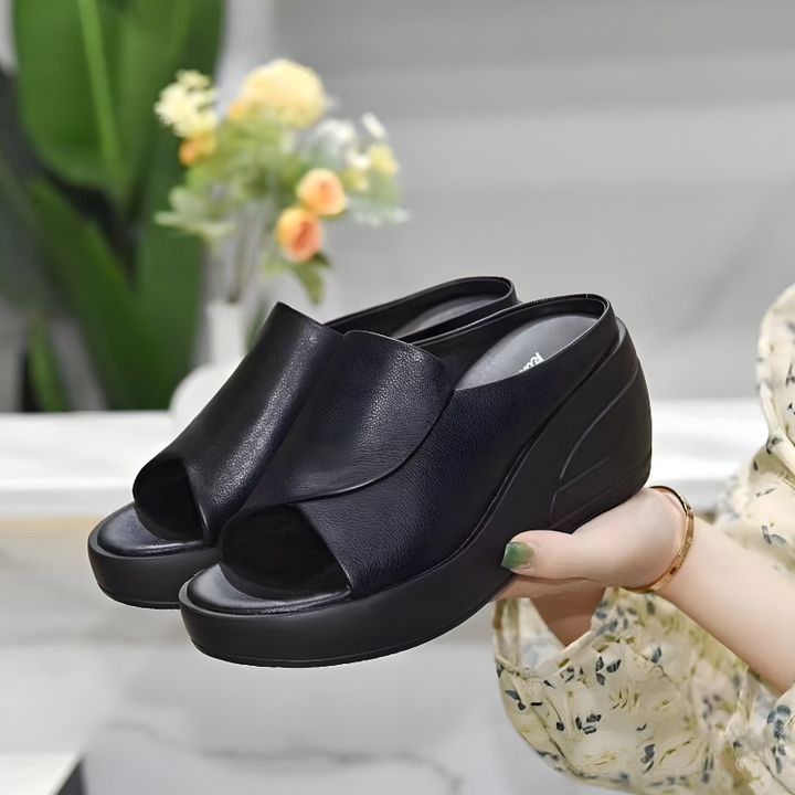 Black slide orthopedic sandals with open toe and thick cushioned platform