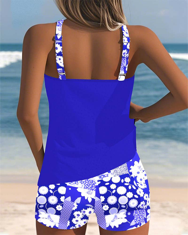 Back view purple swimsuit tank top with printed boxer shorts and white floral strap details