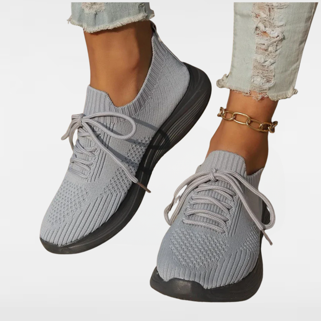 Light gray knit lace-up sneakers with ribbed collar and chunky black sole