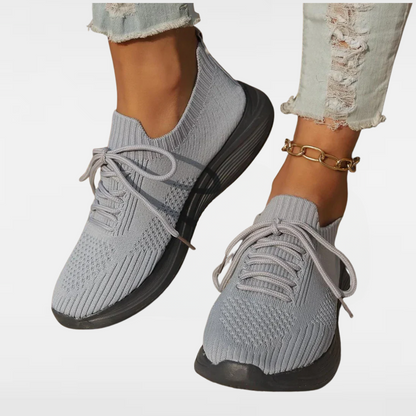Light gray knit lace-up sneakers with ribbed collar and chunky black sole