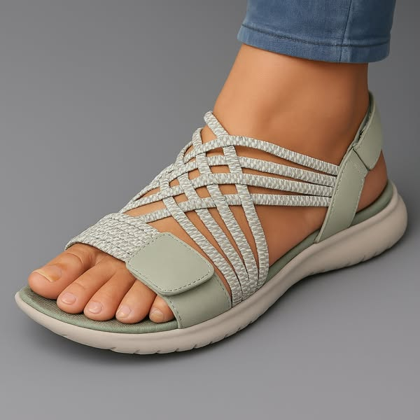 Light green orthopaedic sandals with white woven side straps and open toe cushioned sole.
