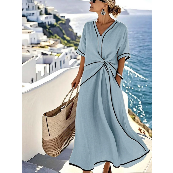 Blue summer maxi dress with V-neck and black trim, short sleeves, knotted front twist