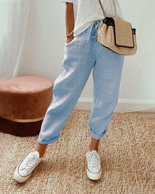 Light blue retro jogger pants with drawstring waist and cuffed hems