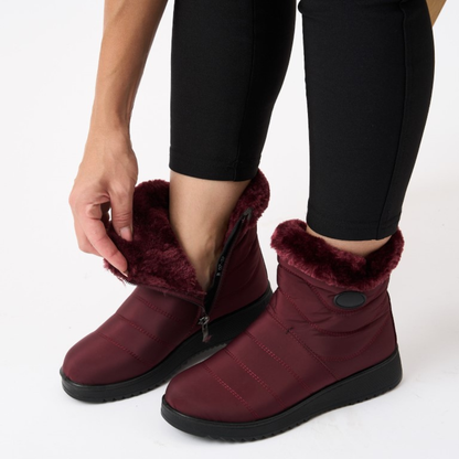 Burgundy/red ankle boots with faux fur cuff and side zipper, grippy sole