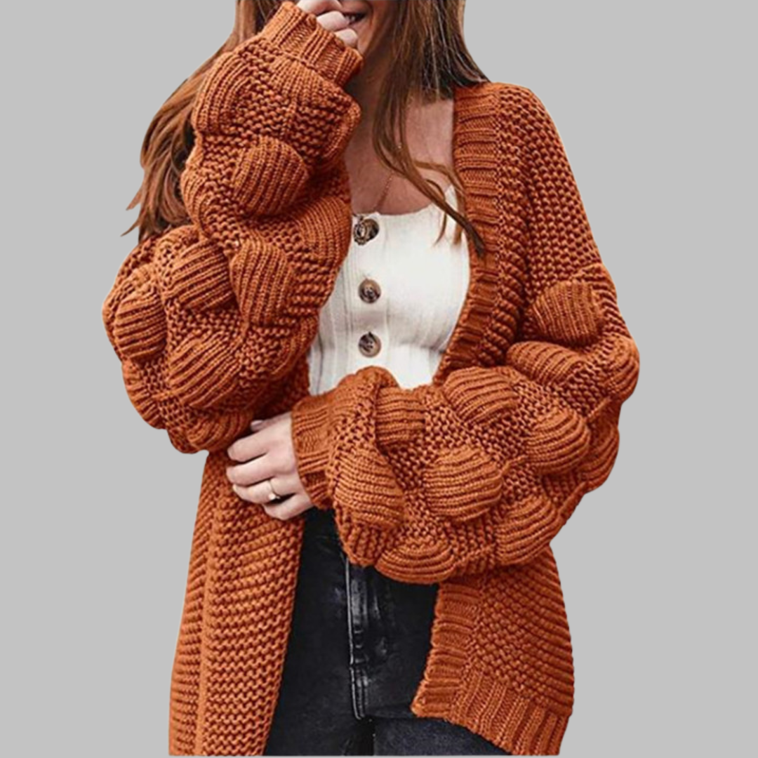 Orange-red oversized chunky open-front cardigan with ribbed cuffs and textured knit