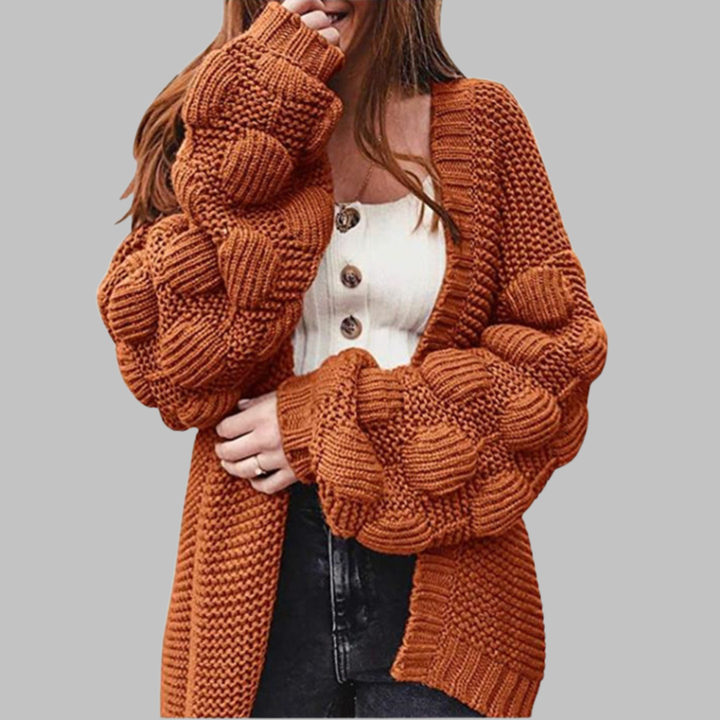 Orange-red oversized chunky open-front cardigan with ribbed cuffs and textured knit