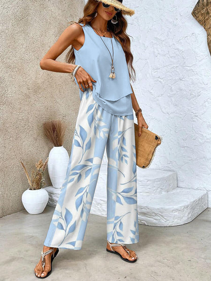 Light blue sleeveless blouse and wide-leg leaf-print trousers, flowing two-piece set