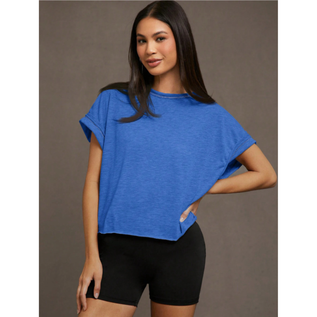Blue women’s cut out hemline short-sleeve top, crew neck, relaxed drape
