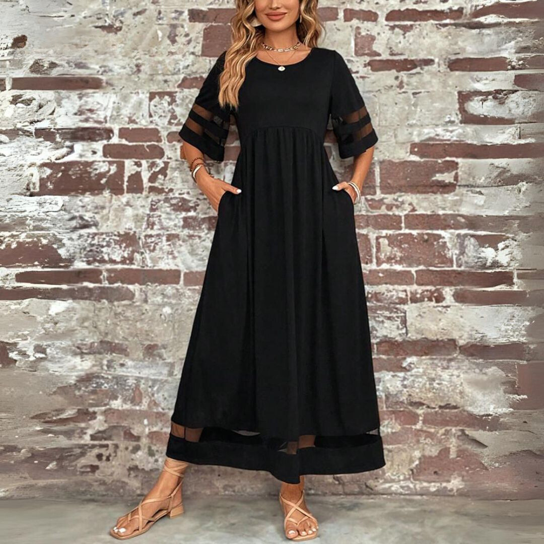 Black maxi dress with scoop neck, tiered waist, and banded sleeve cutouts