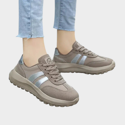 Gray lace-up orthopedic sneakers with light blue stripes and textured rubber outsole