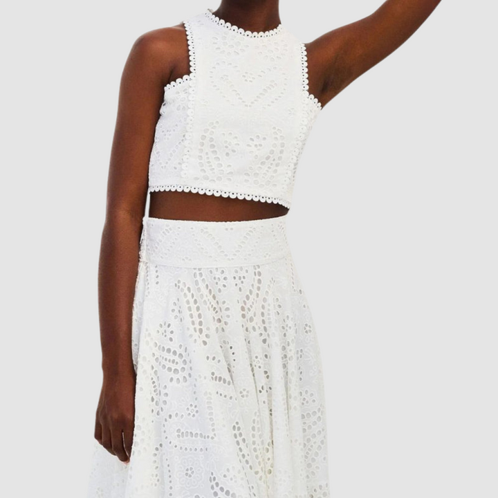 White sleeveless lace crop top and maxi skirt two-piece set with eyelet pattern