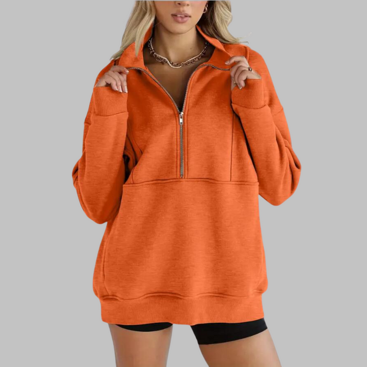 Orange oversized half-zip sweatshirt with front zipper and kangaroo pocket, ribbed cuffs