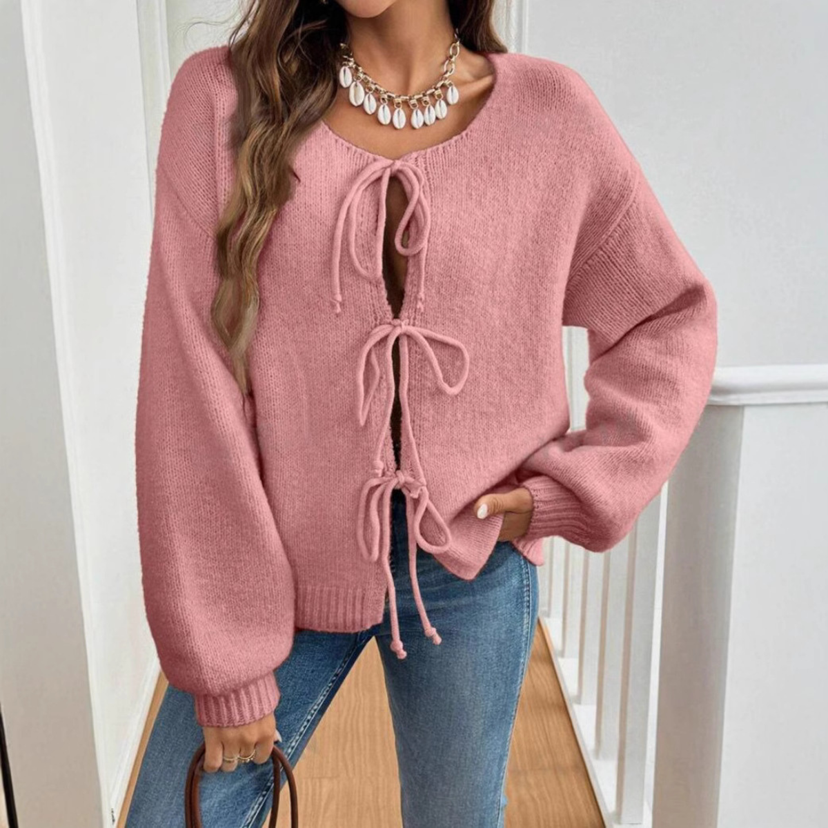 Pink tie-front cardigan with round neck and drawstring lacing, long sleeves