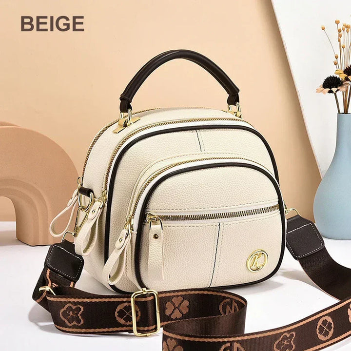 Mini chic crossbody shoulder bag in beige with gold-tone hardware and zip compartments