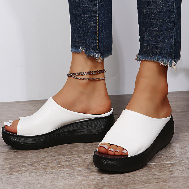 White orthopedic slide sandals with wide open toe and thick black platform sole