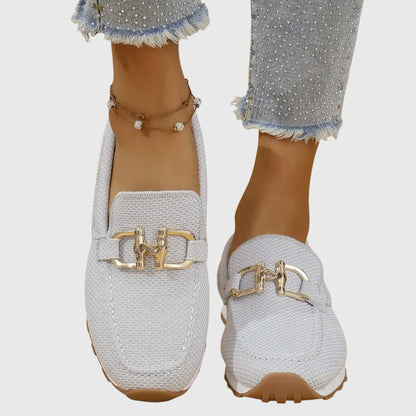 White textured loafer sneakers with gold-toned buckle accents