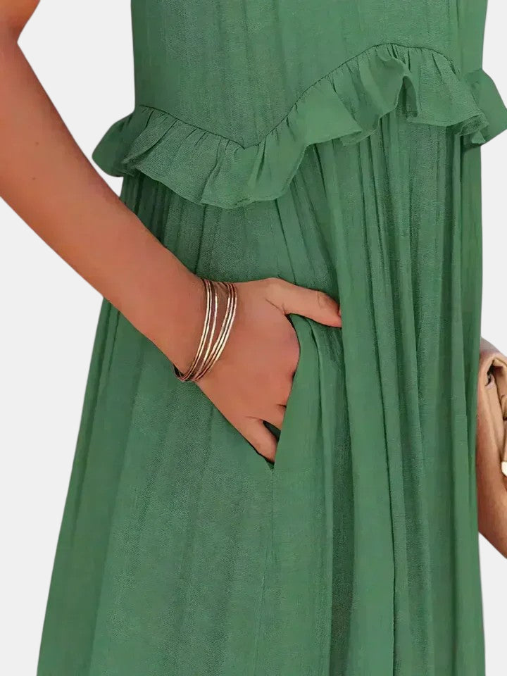 Green sleeveless long dress with tiered ruffle layers and gathered bodice detail