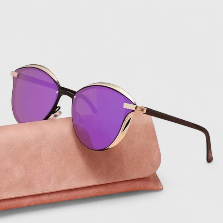 Purple mirrored round sunglasses with gold bar accents and dark brown arms