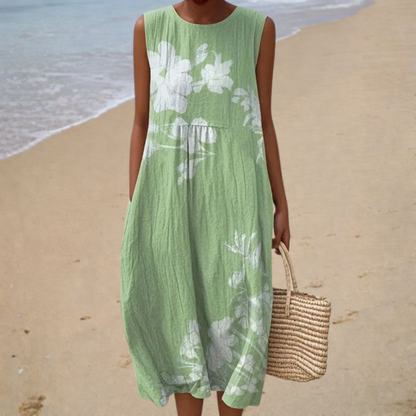 Green sleeveless summer dress with white floral print