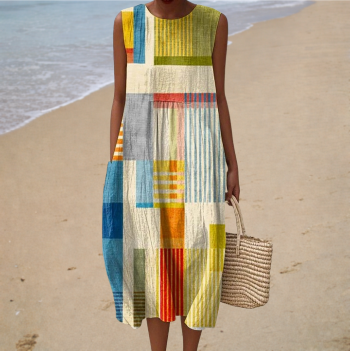 Sleeveless patchwork summer dress with round neckline, multicolor vertical stripes.