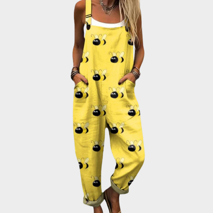 Yellow printed overalls with playful bee face pattern, wide bib front and straps
