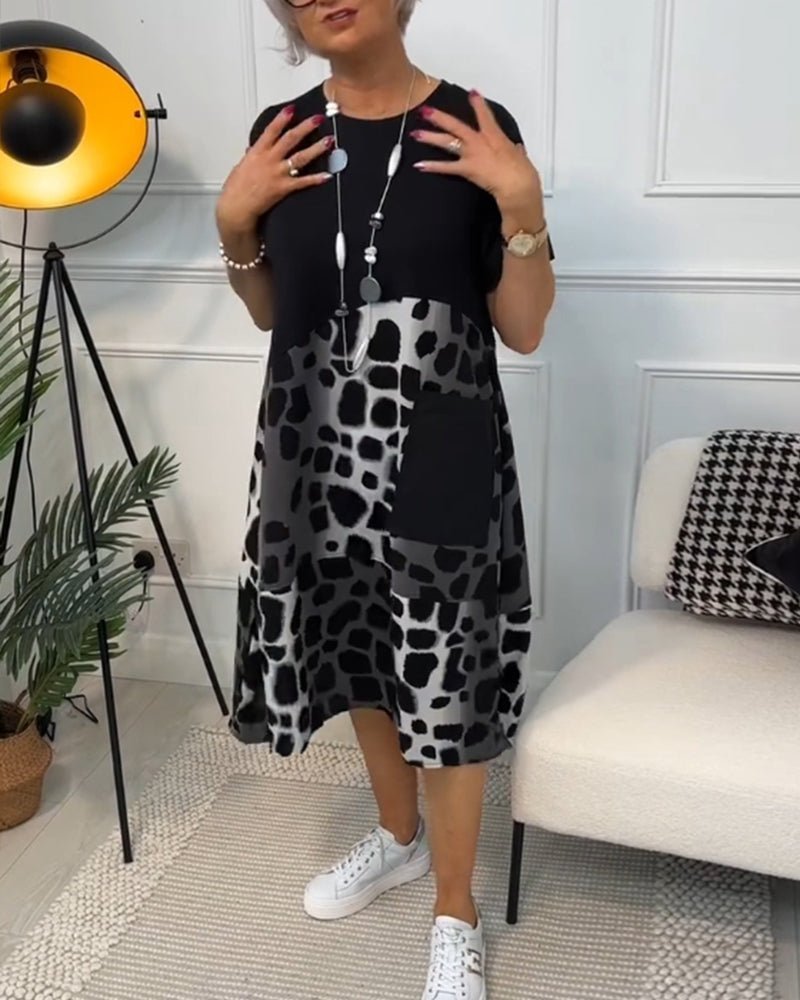 Women's black midi dress with leopard print front panel, short sleeves, pullover style