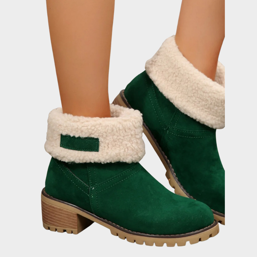 Green suede mid-heel winter boots with sherpa trim and stitched side panels