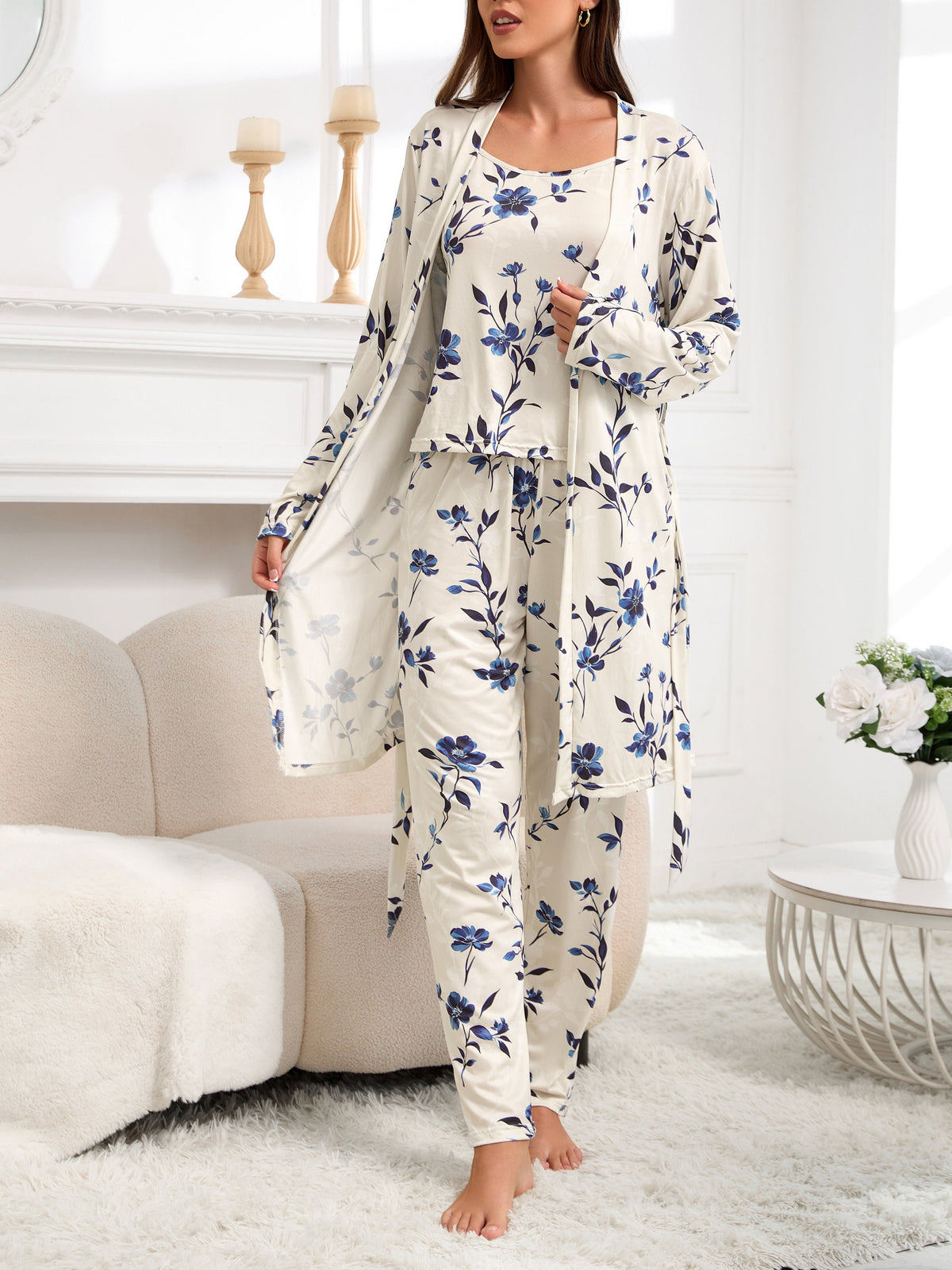 Women’s pajama set in cream with blue floral print, open long-sleeve top and matching pants