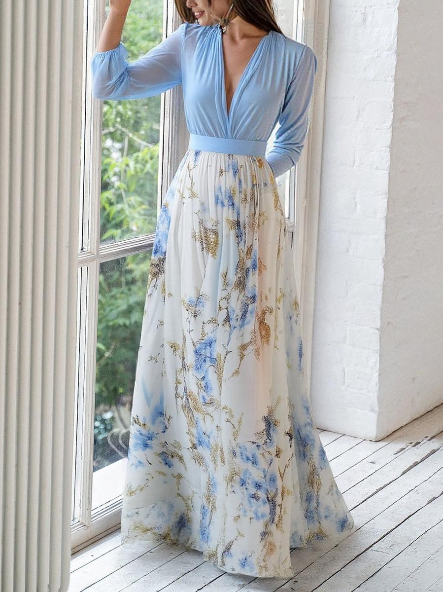 Floral maxi dress with light blue long sleeves, V-neck bodice, and pleated skirt