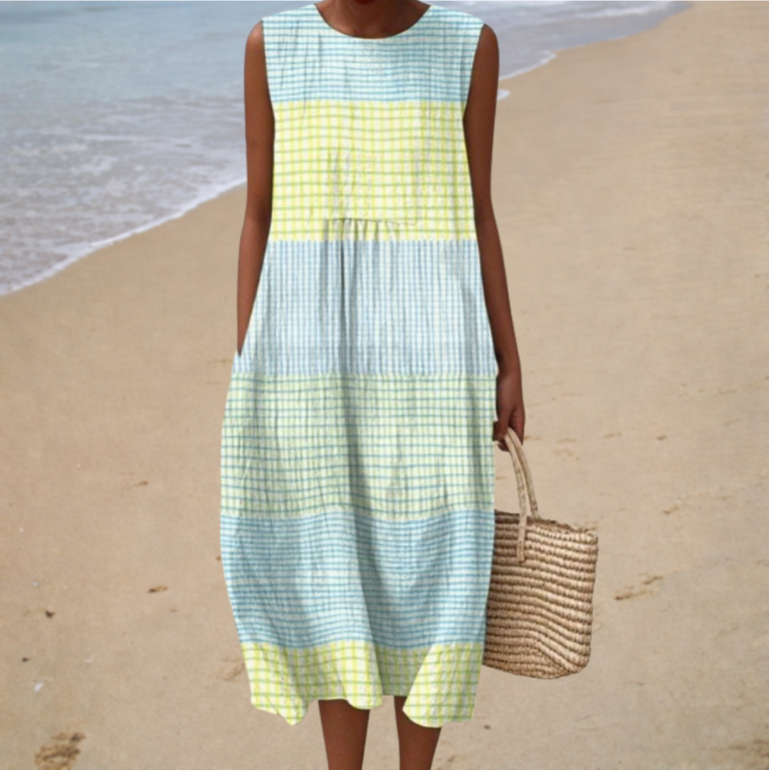 Sleeveless summer dress with blue and yellow check color blocks, tiered skirt, crew neck.
