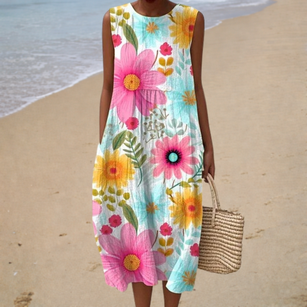 Sleeveless summer dress with bright floral print, crew neck, and knee-length fit