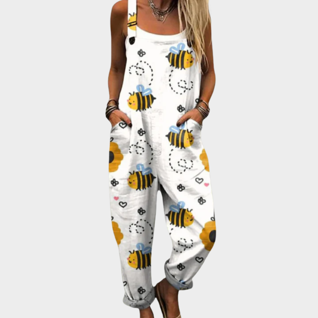 White printed overalls with bee and flower motifs, sleeveless bib front and long legs