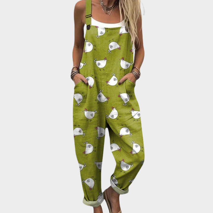 Green printed overalls with bird faces, wide legs and adjustable straps