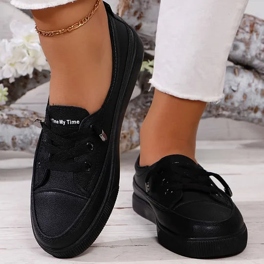 Black lace-up orthopedic shoes with padded collar and chunky sole