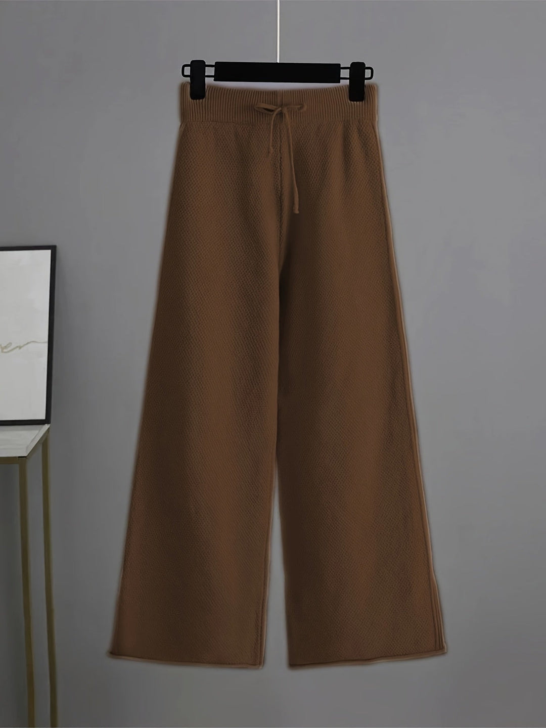 Tan wide-leg knit trousers with drawstring waistband
