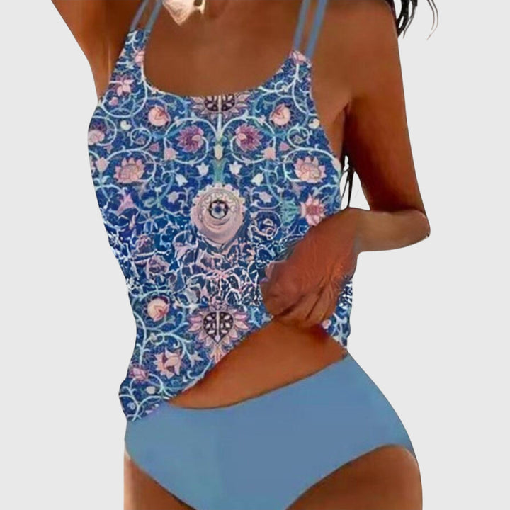 Blue floral patterned tank-style swimwear set with solid light blue brief bottom and thin straps