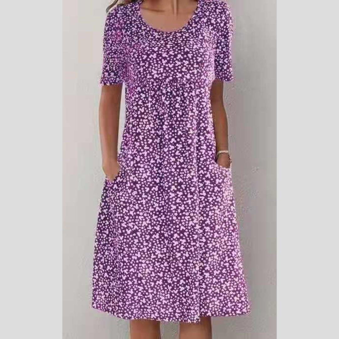 Floral summer dress in purple with short sleeves and scoop neckline, midi length