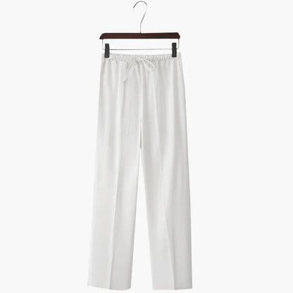 White linen pants on hanger, elastic drawstring waist with relaxed wide legs