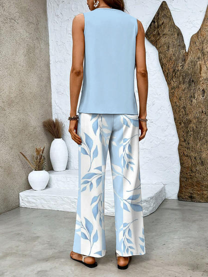 Light blue sleeveless back blouse and leaf-print wide-leg trousers, two-piece set