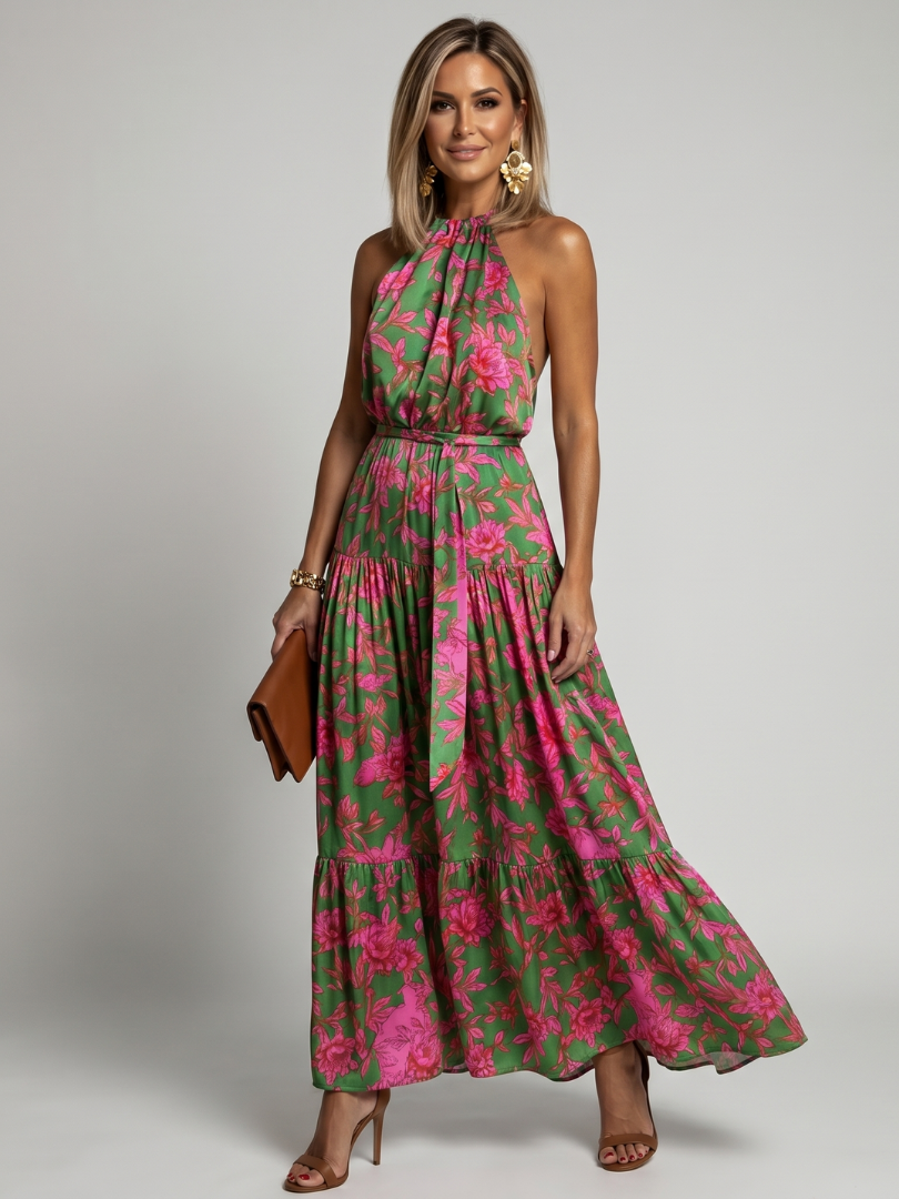 Floral halter midi dress with tiered ruffle skirt and pink blooms on green, side view.