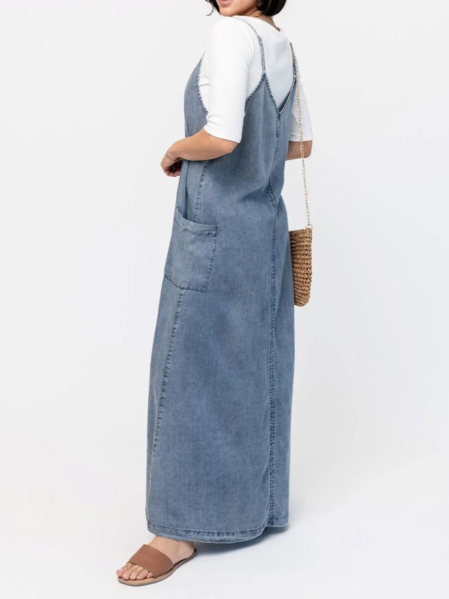 Blue denim-look loose maxi dress with V neckline, side pockets, and spaghetti straps