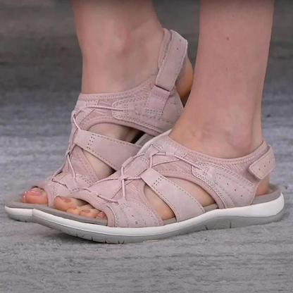 Pink orthopaedic sandals with adjustable straps, open toe, and white cushioned sole
