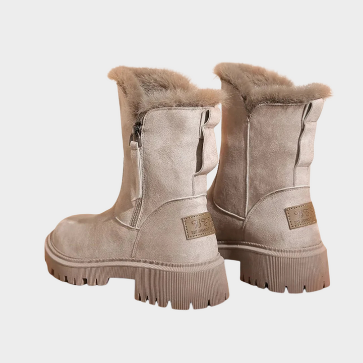 Beige comfort boots with side zippers, fur trim at the top, and platform soles