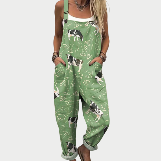 Green printed overalls with dog and floral pattern, sleeveless bib front and wide legs
