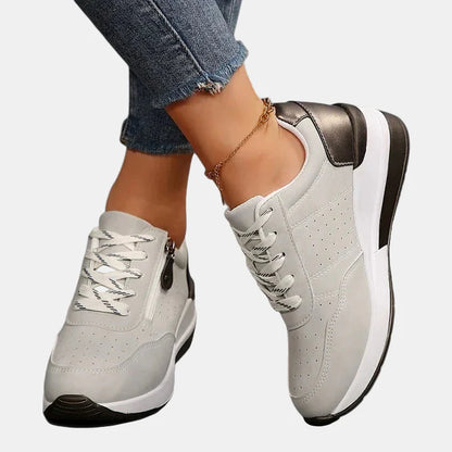 Orthopedic shoes in white with white laces, bronze heel accent and chunky sole