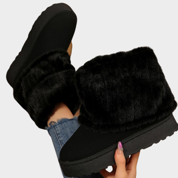 Black faux-fur lined boots with wide cuff and treaded sole