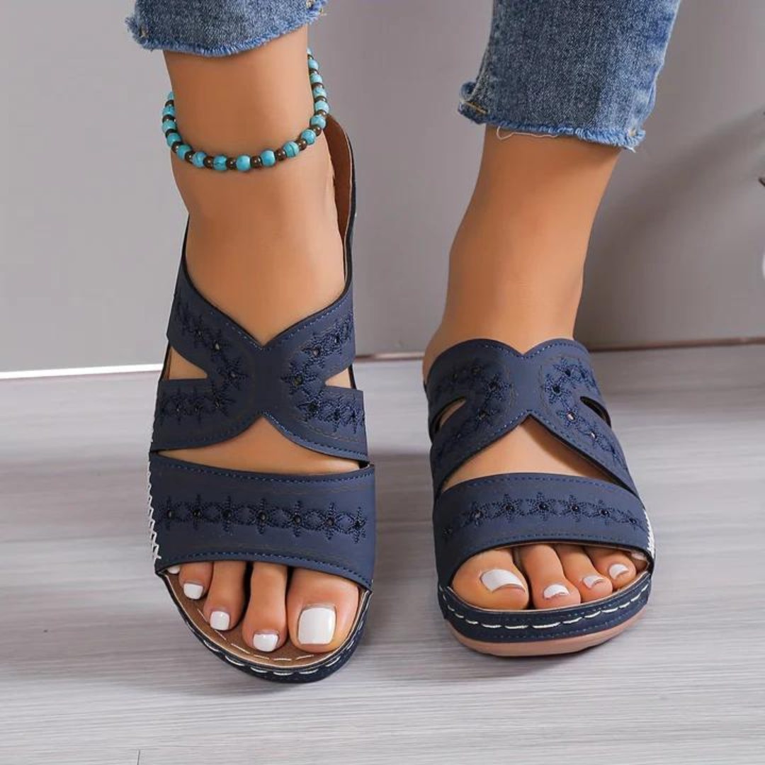 Orthopedic sandals with navy blue straps and open toe, cross strap design, cushioned sole