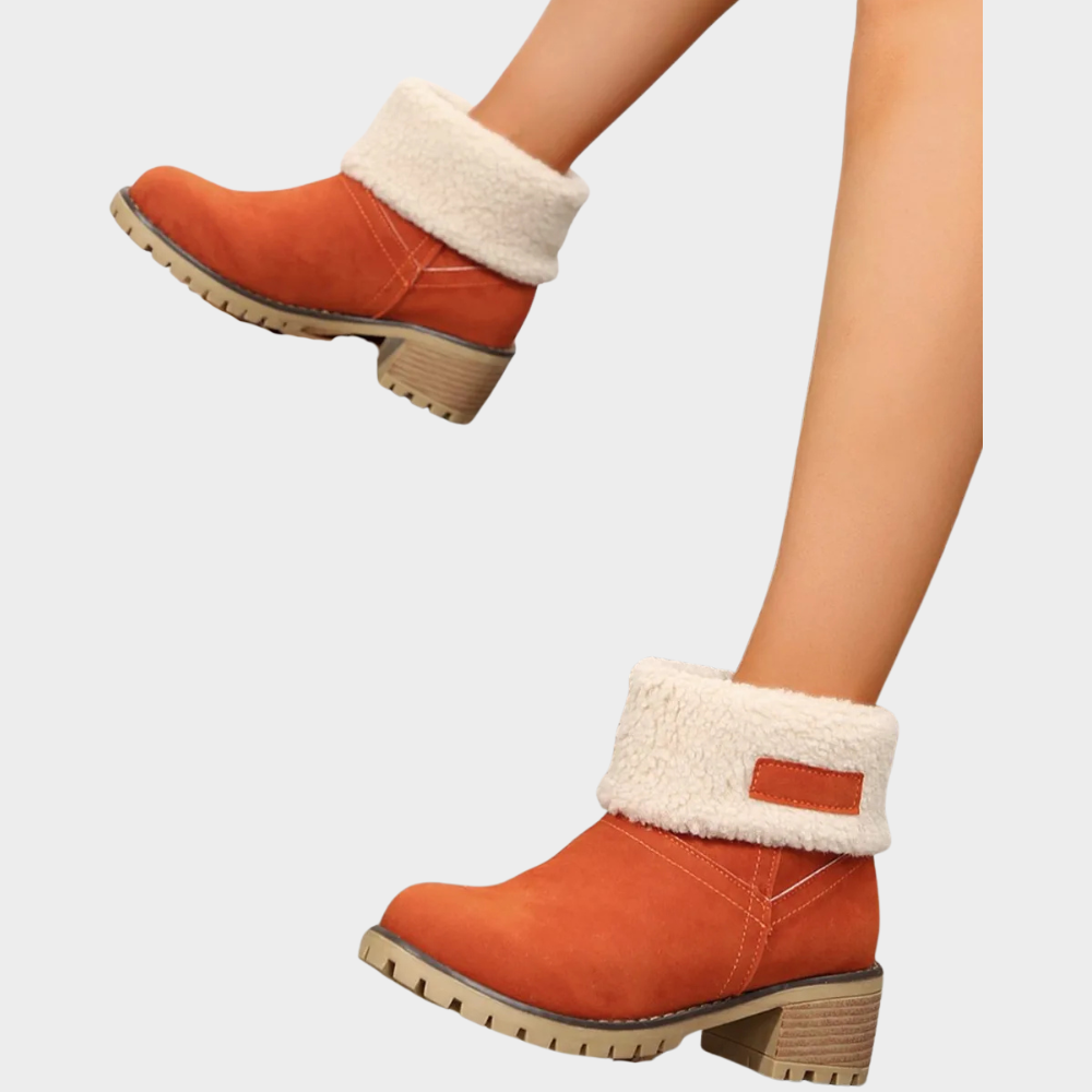 Orange suede winter boots with faux-sherpa cuff and textured lug sole with block heel