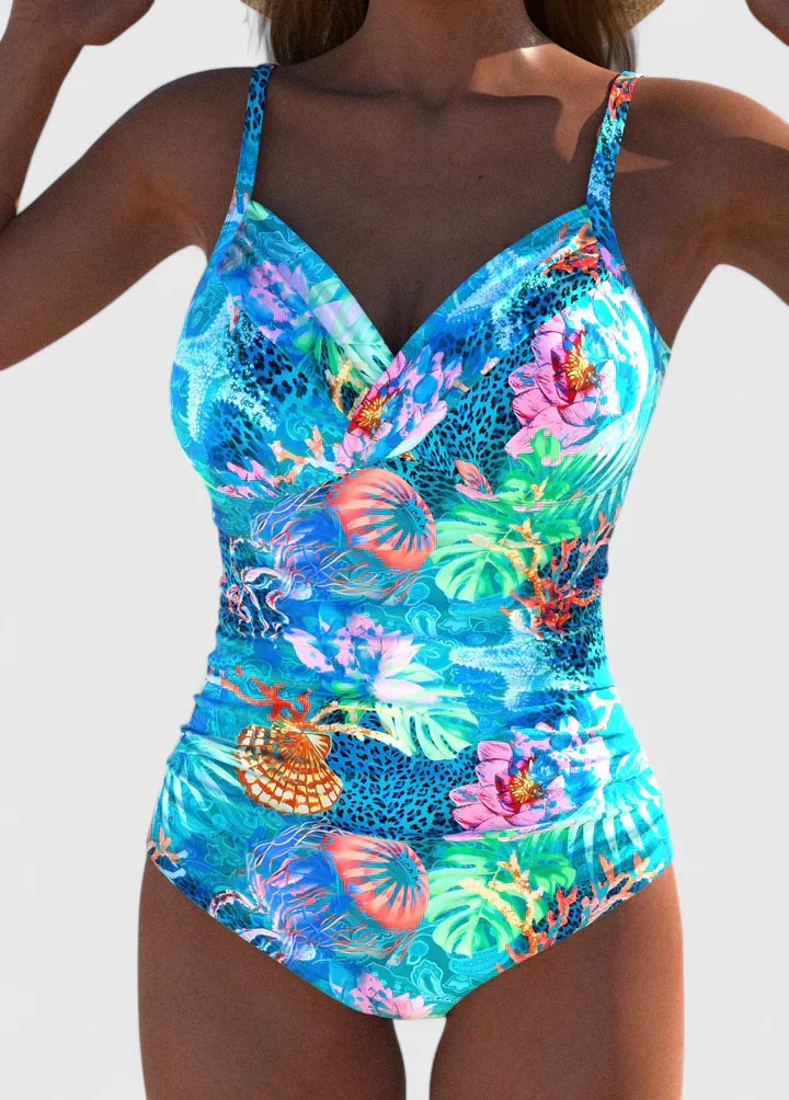 Women's cyan printed one-piece swimsuit with gathered V-neck and ruched sides