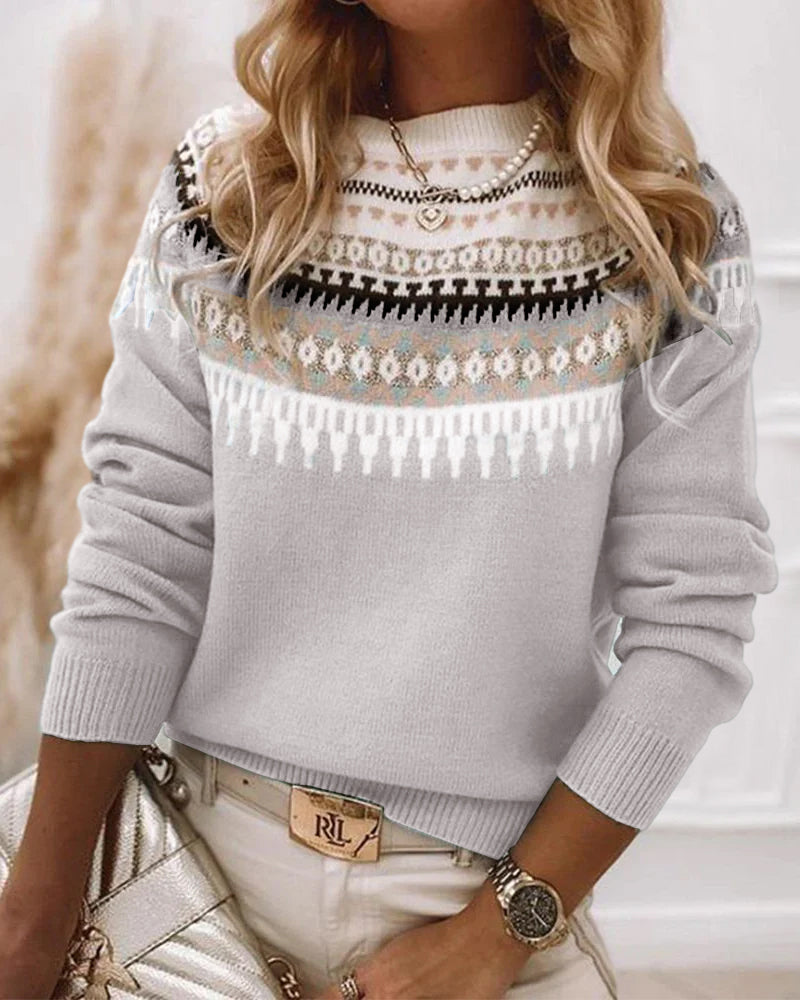 Light grey Fair Isle knit sweater with patterned yoke and bands across the chest